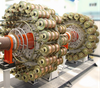 Close-up of metal rope winding process for composite pipe reinforcement