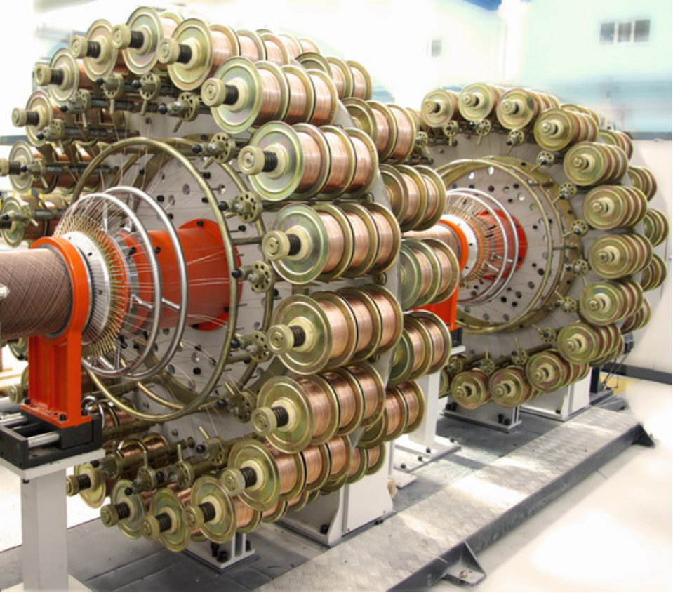 Close-up of metal rope winding process for composite pipe reinforcement
